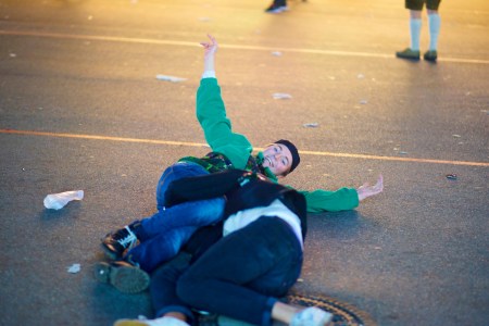 Drunk Men Lying On Road At Night