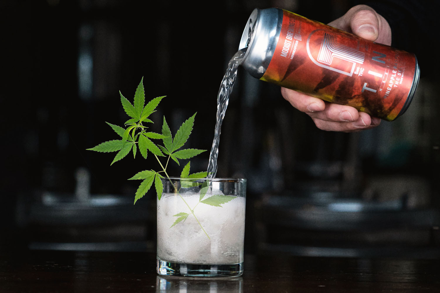 A THC seltzer being poured into a glass