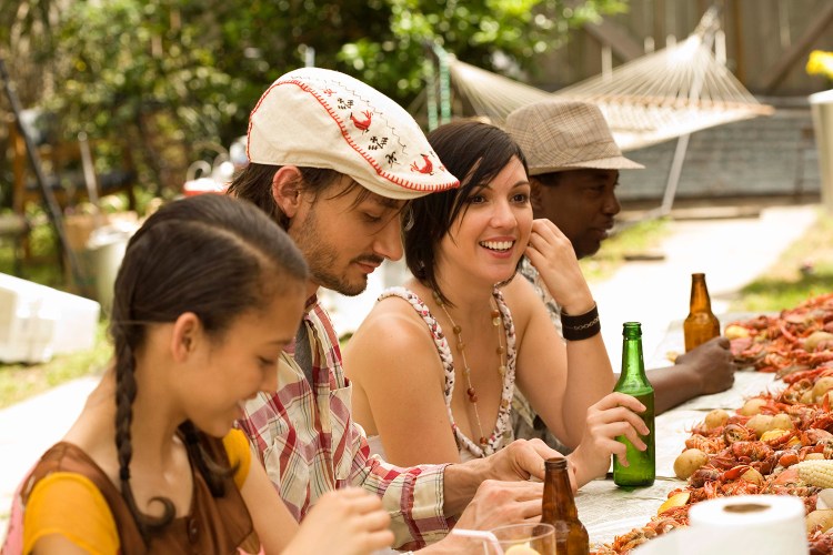 Friends eating at seafood boil