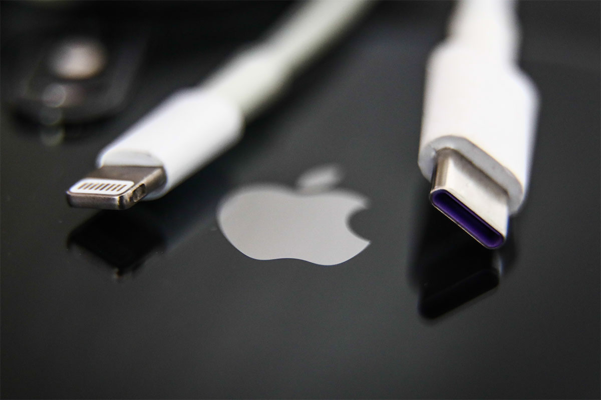 Lightning and USB-C cables are seen with Apple iPhone in this illustration photo taken in Krakow, Poland on September 25, 2021.