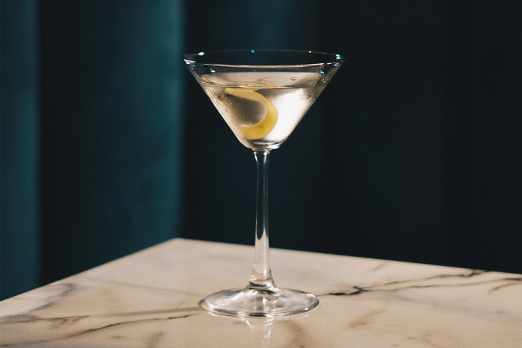 A martini with a lemon twist