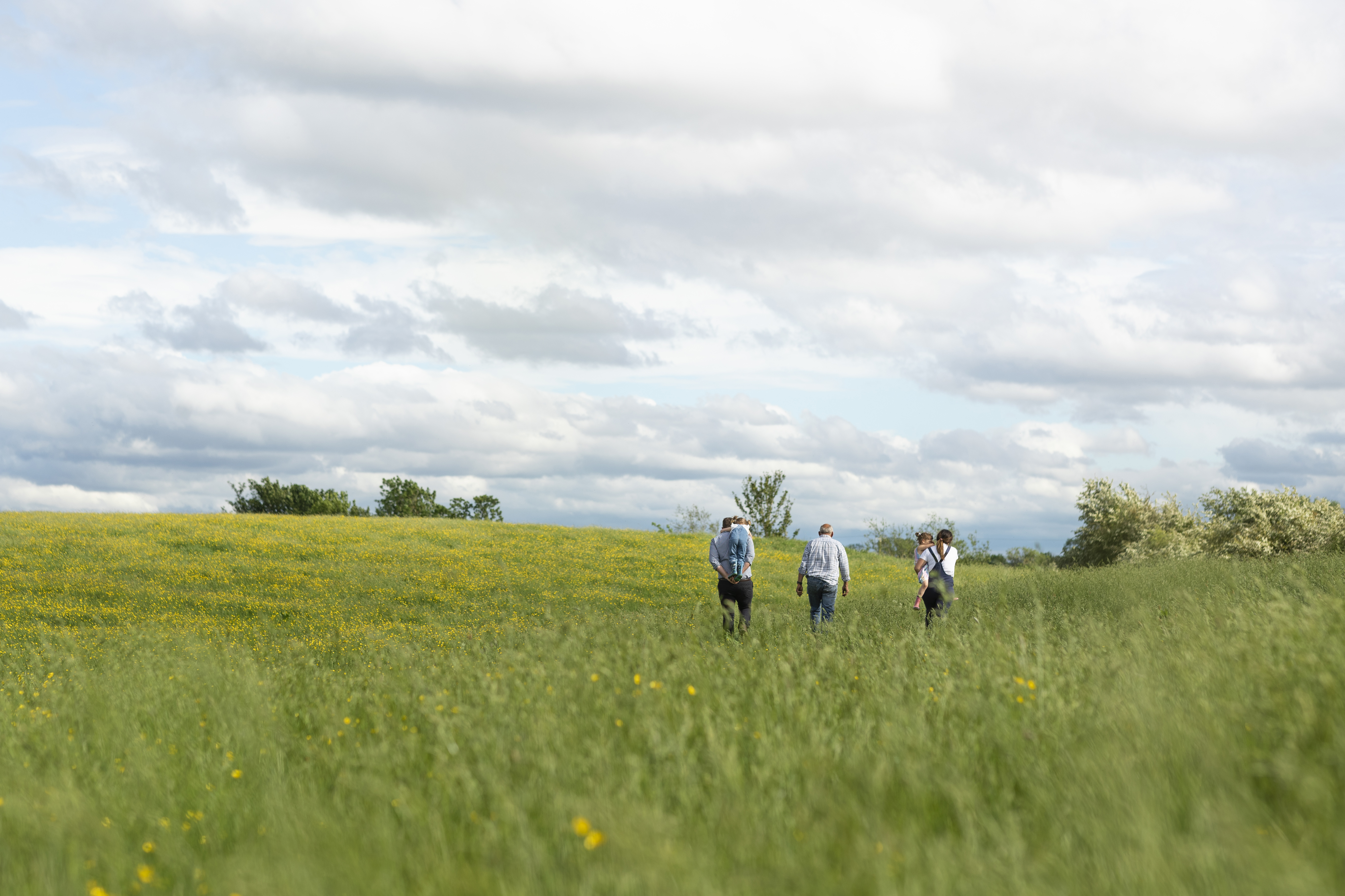 A family walking through a field.